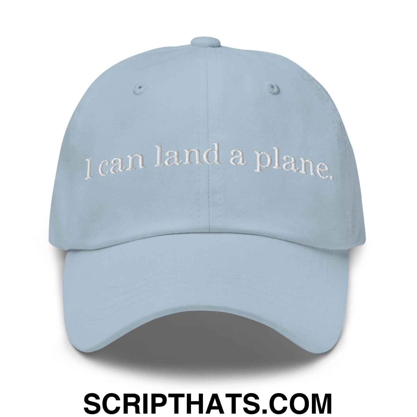 Light blue unstructured dad hat with white embroidered text i can land a plane for casual wear