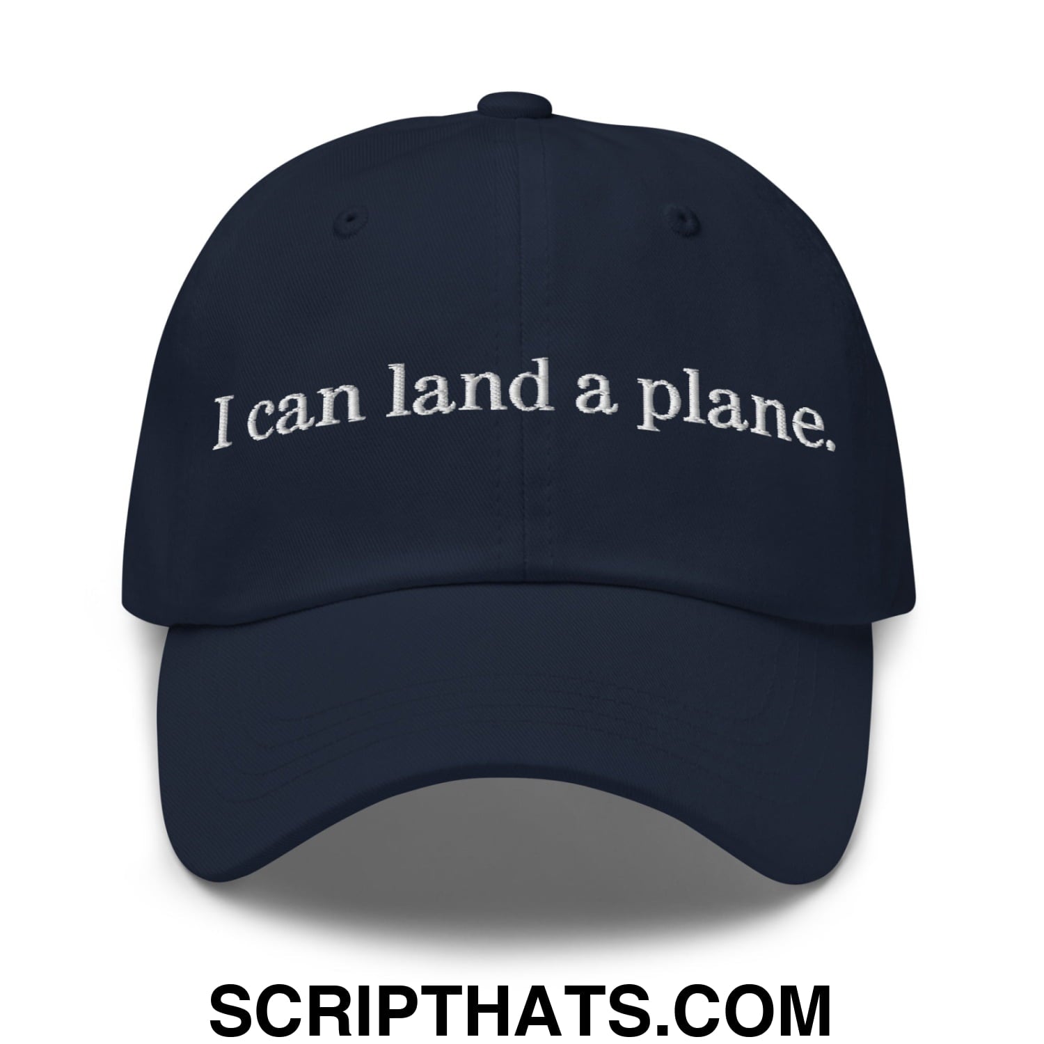 Navy blue unstructured dad hat with white embroidered text i can land a plane in a casual style