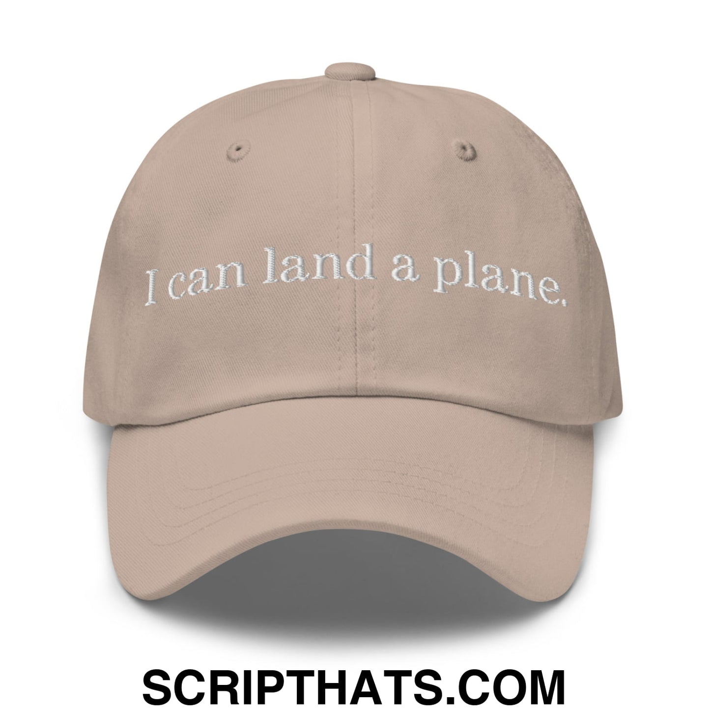 Beige unstructured dad hat with white embroidered text reading i can land a plane in casual cotton fabric