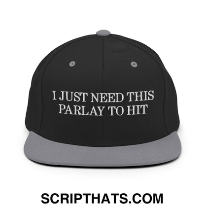 Black snapback cap with gray flat bill and white embroidered text i just need this parlay to hit on front panel
