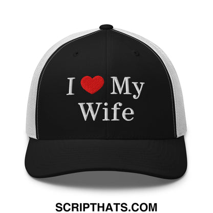 Black and white mesh trucker hat with embroidered i love my wife text in white thread and a red heart symbol