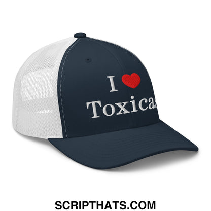 Navy blue and white mesh trucker hat with silver embroidered i love toxicas text on the front panel