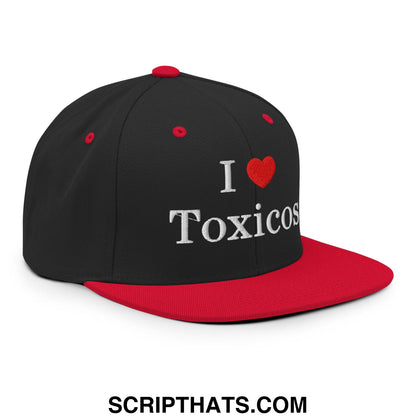 Black and red snapback hat with white embroidered i love toxicos text on flat bill brim for casual wear