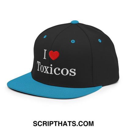 Black snapback hat with teal flat bill brim and embroidered white i love toxicos text on front panel