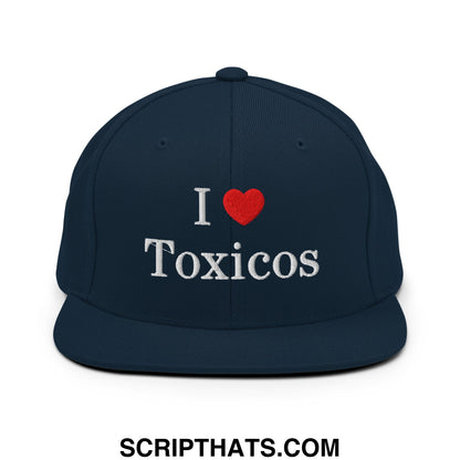 Navy blue snapback hat with white embroidered i heart toxicos text and red heart on flat bill brim
