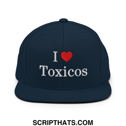 Navy blue snapback hat with white embroidered i heart toxicos text and red heart on flat bill brim