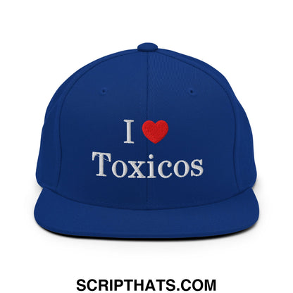 Royal blue snapback hat with white embroidered i heart toxicos text and red heart flat bill brim design
