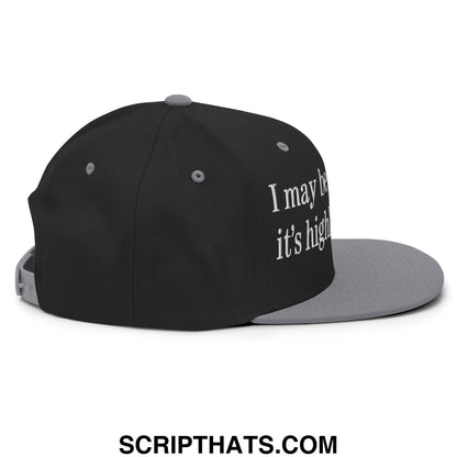 Black and gray snapback cap with white embroidered text i may be wrong but its highly unlikely flat bill brim