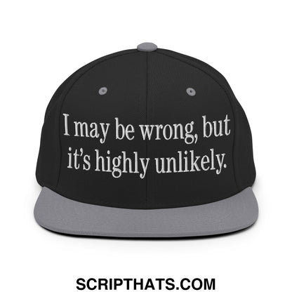 Black snapback cap with gray brim and matching button featuring white embroidered text i may be wrong but its highly unlikely