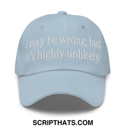 Light blue unstructured dad hat with white embroidered text i may be wrong but its highly unlikely baseball cap