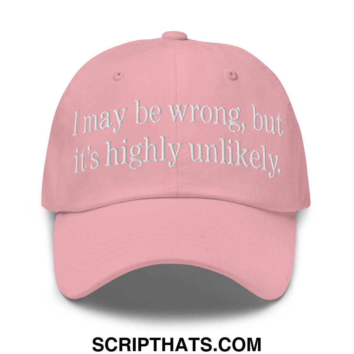A soft pink unstructured dad hat with white embroidered text reading i may be wrong but it’s highly unlikely