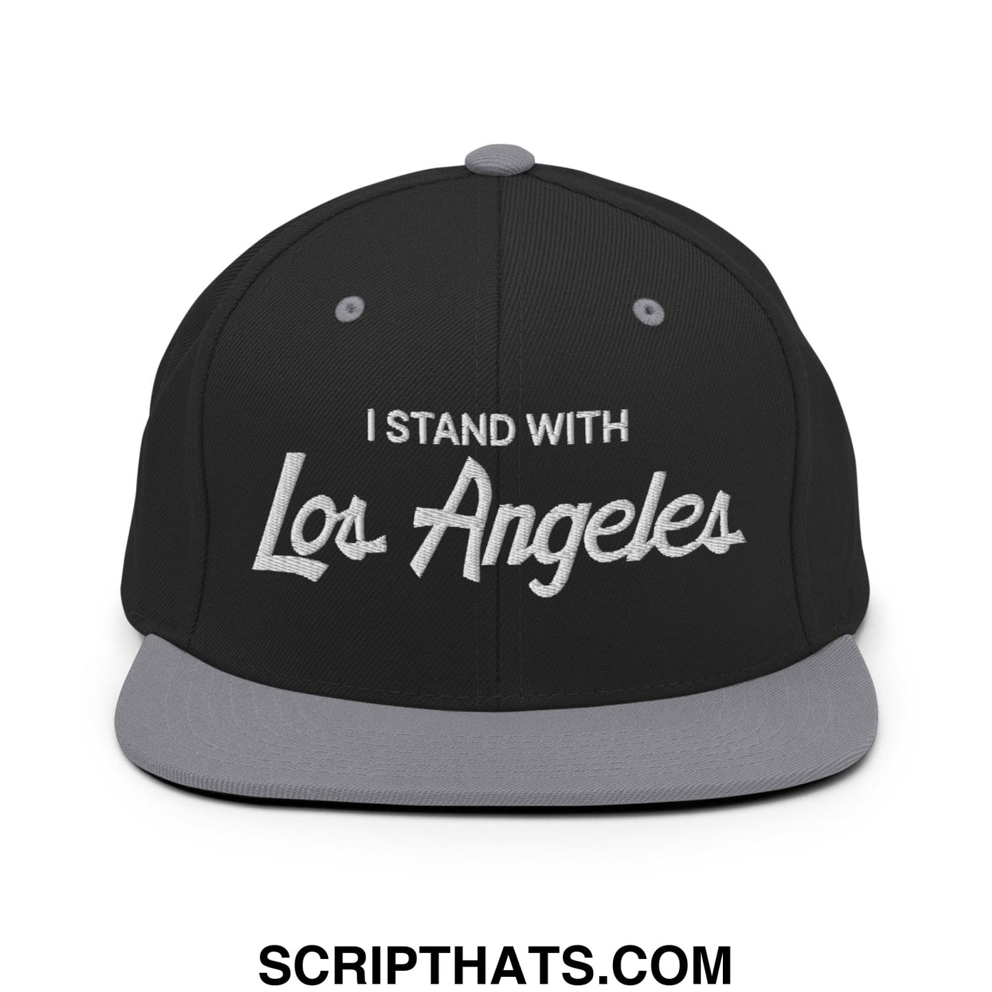 Black snapback cap with gray brim and white embroidered i stand with los angeles vintage sports script text