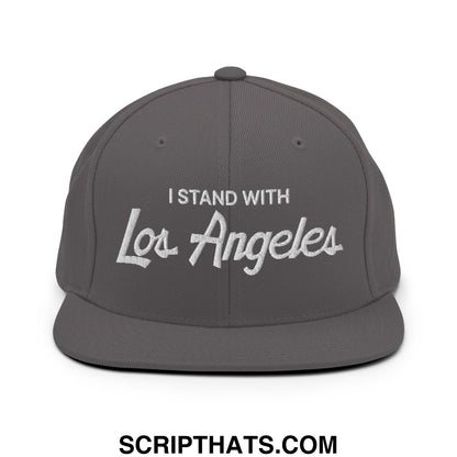 Gray snapback cap with white embroidered vintage script text i stand with los angeles on flat bill brim