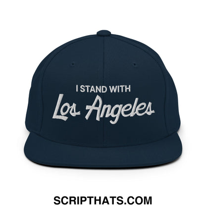Navy blue snapback hat with white embroidered i stand with los angeles vintage sports script design