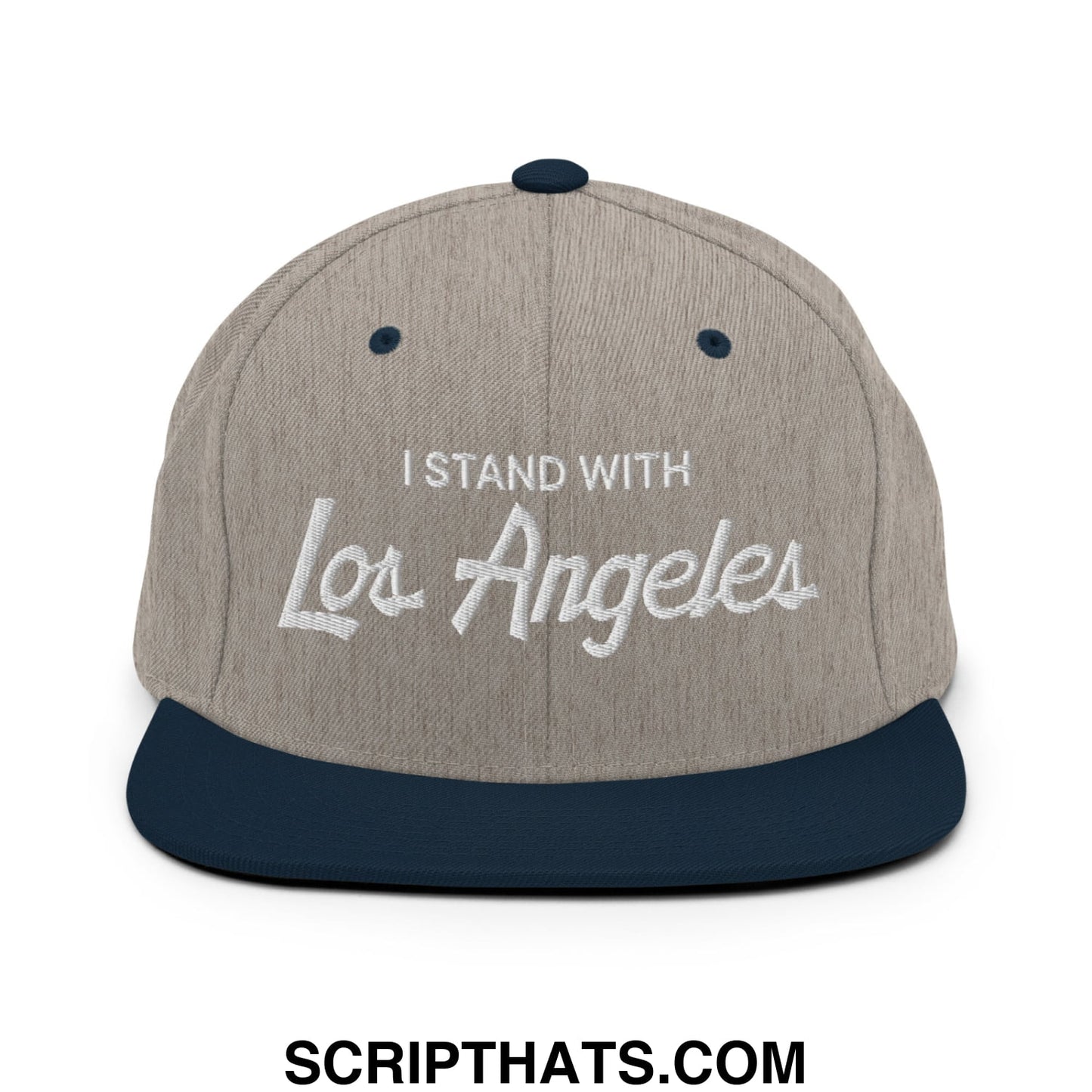 A gray and navy blue snapback hat with i stand with Los Angeles embroidered in white script on the front