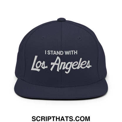 Navy blue snapback hat with white embroidered i stand with los angeles script on front flat bill brim design