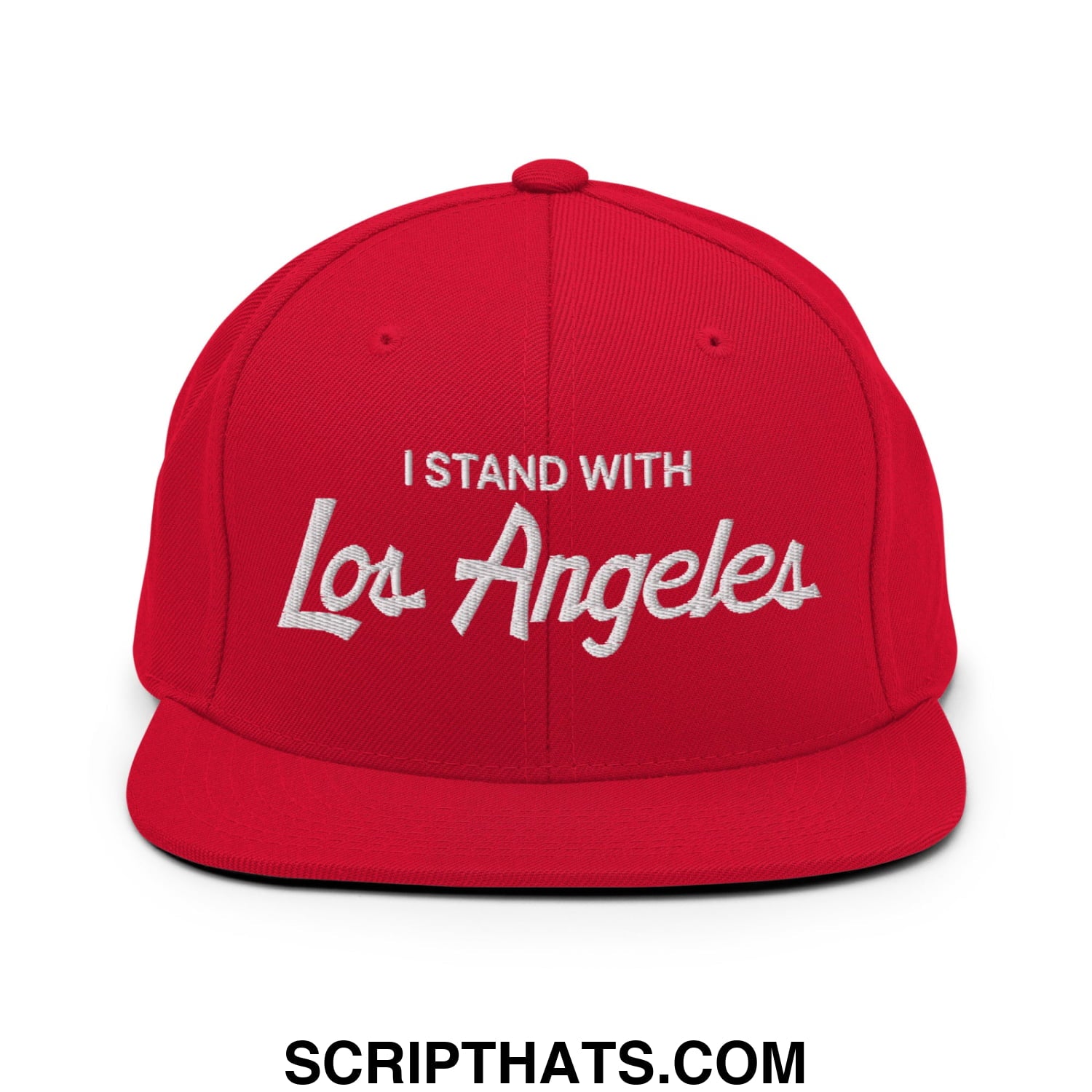 Red snapback cap with white embroidered i stand with los angeles text featuring a flat bill brim and vintage sports script design