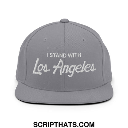 Gray snapback hat with white embroidered i stand with los angeles text and flat bill brim in vintage sports style
