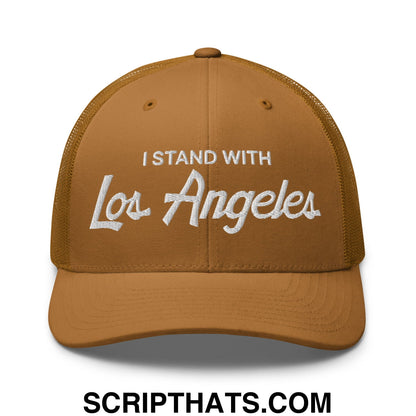 A tan mesh trucker hat with white embroidered i stand with los angeles vintage sports script text