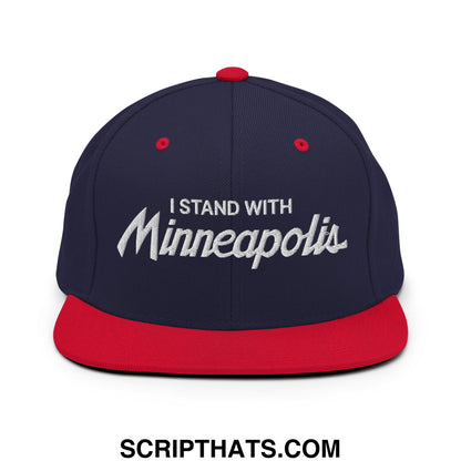 Navy blue and red snapback hat with white embroidered i stand with minneapolis text and flat bill brim