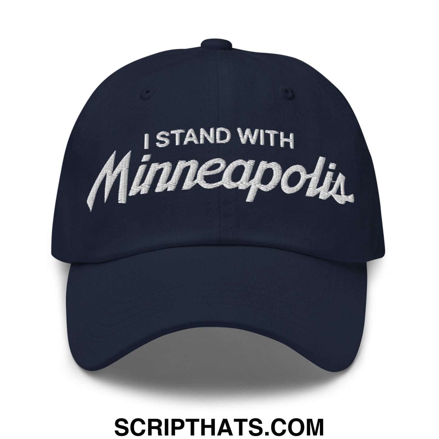 Navy blue unstructured dad hat with white embroidered i stand with minneapolis text in a script font