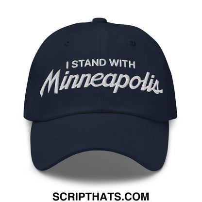 Navy blue unstructured dad hat with white embroidered i stand with minneapolis text in a script font