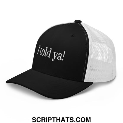 Black and white mesh trucker hat with i told ya embroidered in silver thread on the front panel