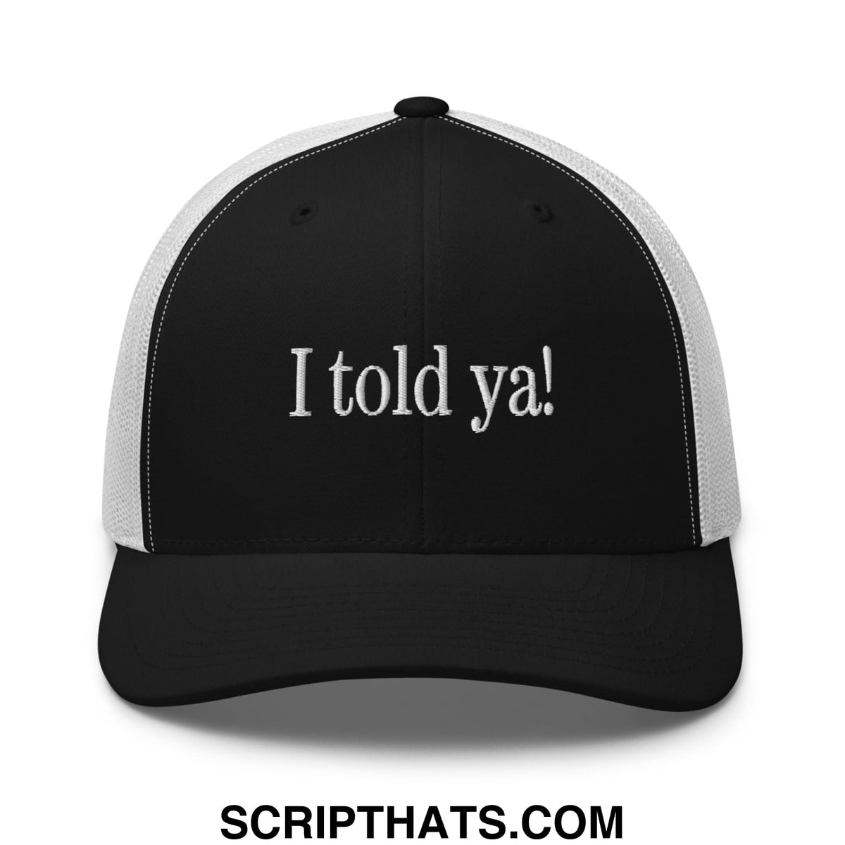 Black and white mesh trucker hat with i told ya embroidered in white script on the front panel