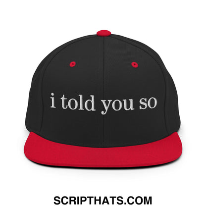 Black and red snapback cap with white embroidered i told you so text on flat bill brim