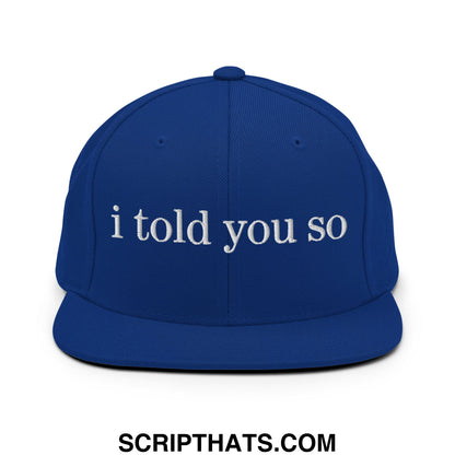 Royal blue snapback cap with white embroidered i told you so text and a flat bill brim for casual wear