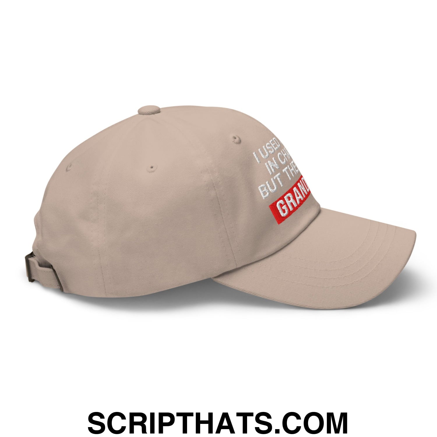 Beige unstructured dad hat with white and red embroidered text i used to be a champion but the grandma on front