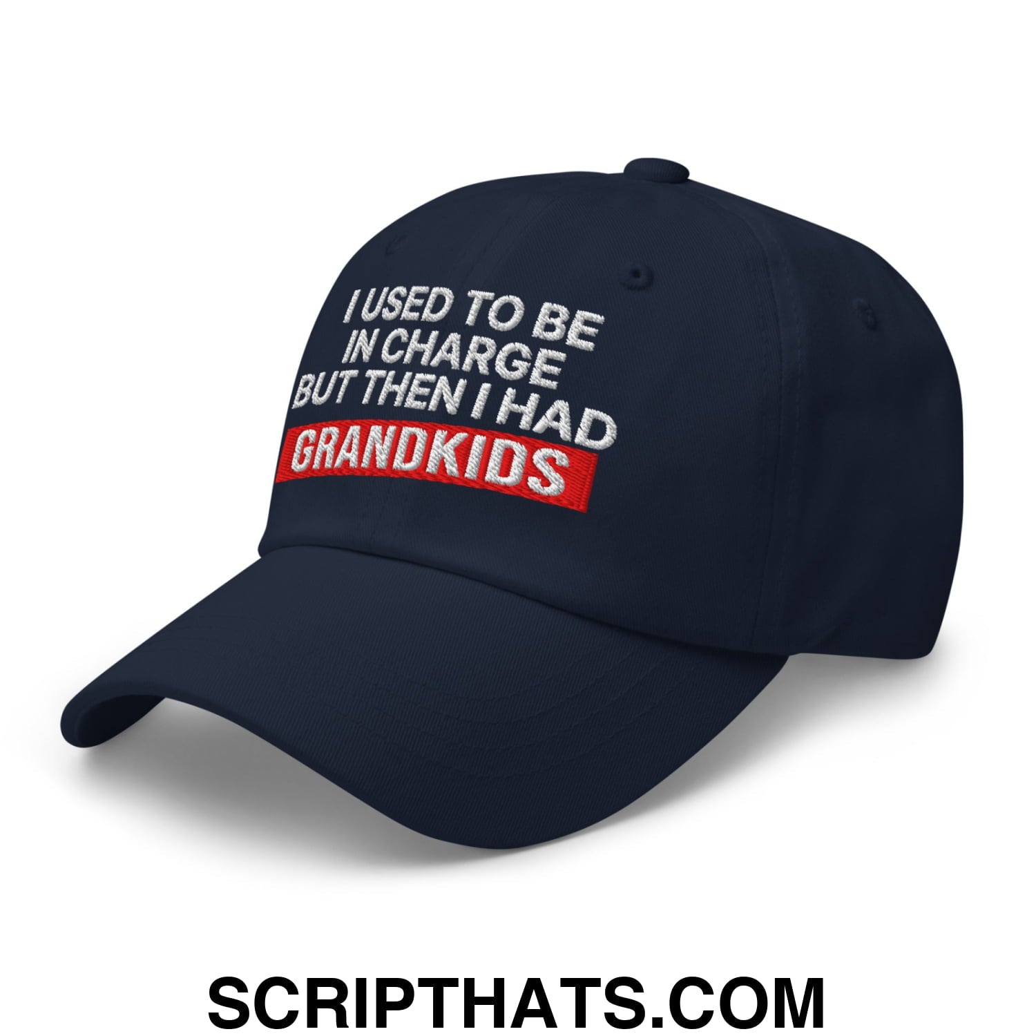 Navy blue unstructured dad hat with embroidered white and red text i used to be in charge but then i had grandkids