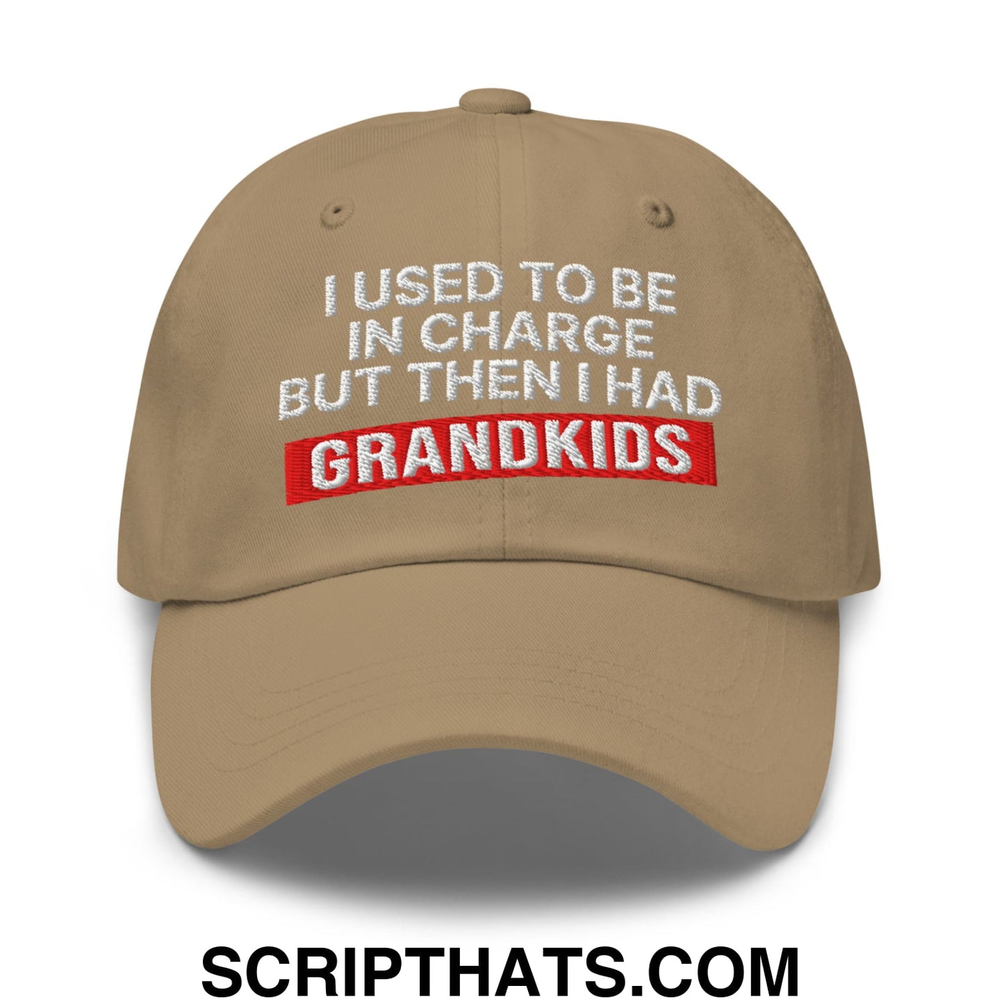 Beige unstructured dad hat with white and red embroidered text reading i used to be in charge but then i had grandkids