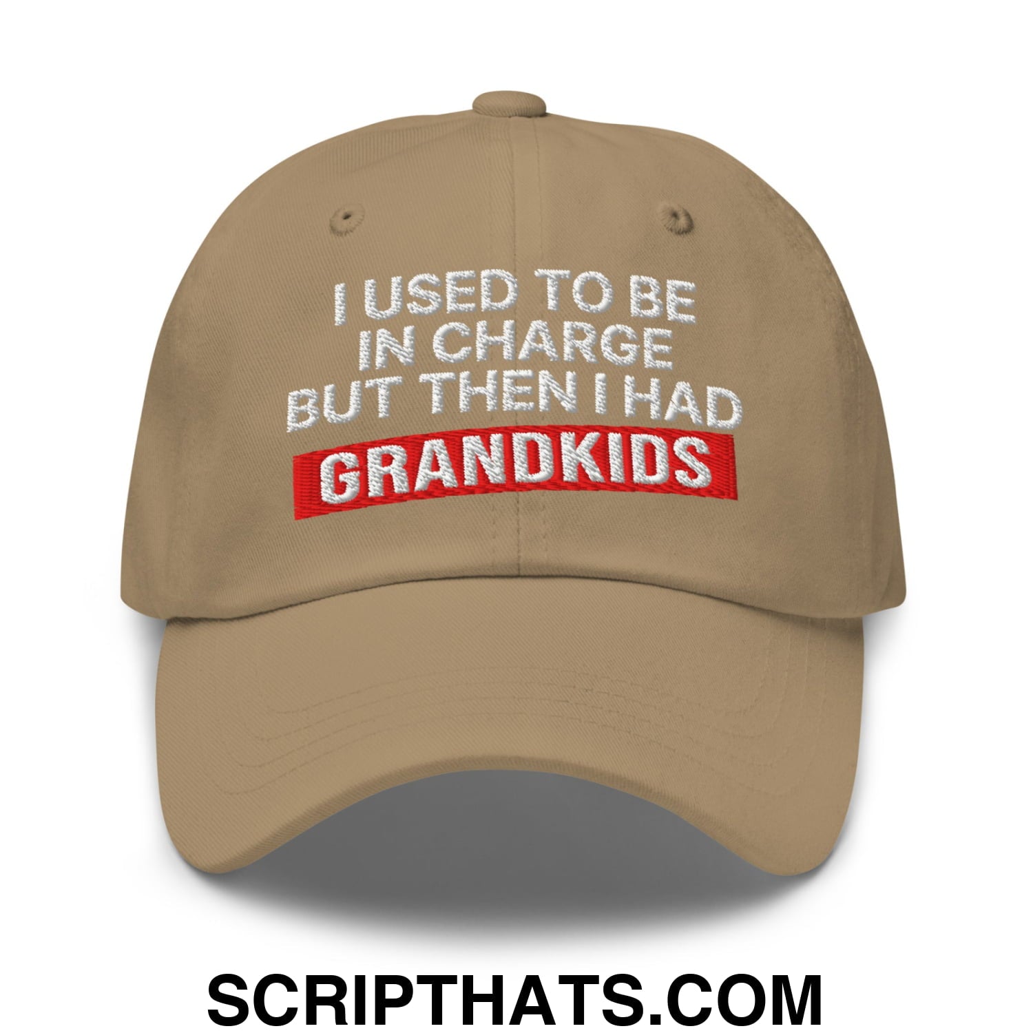 Beige unstructured dad hat with white and red embroidered text reading i used to be in charge but then i had grandkids