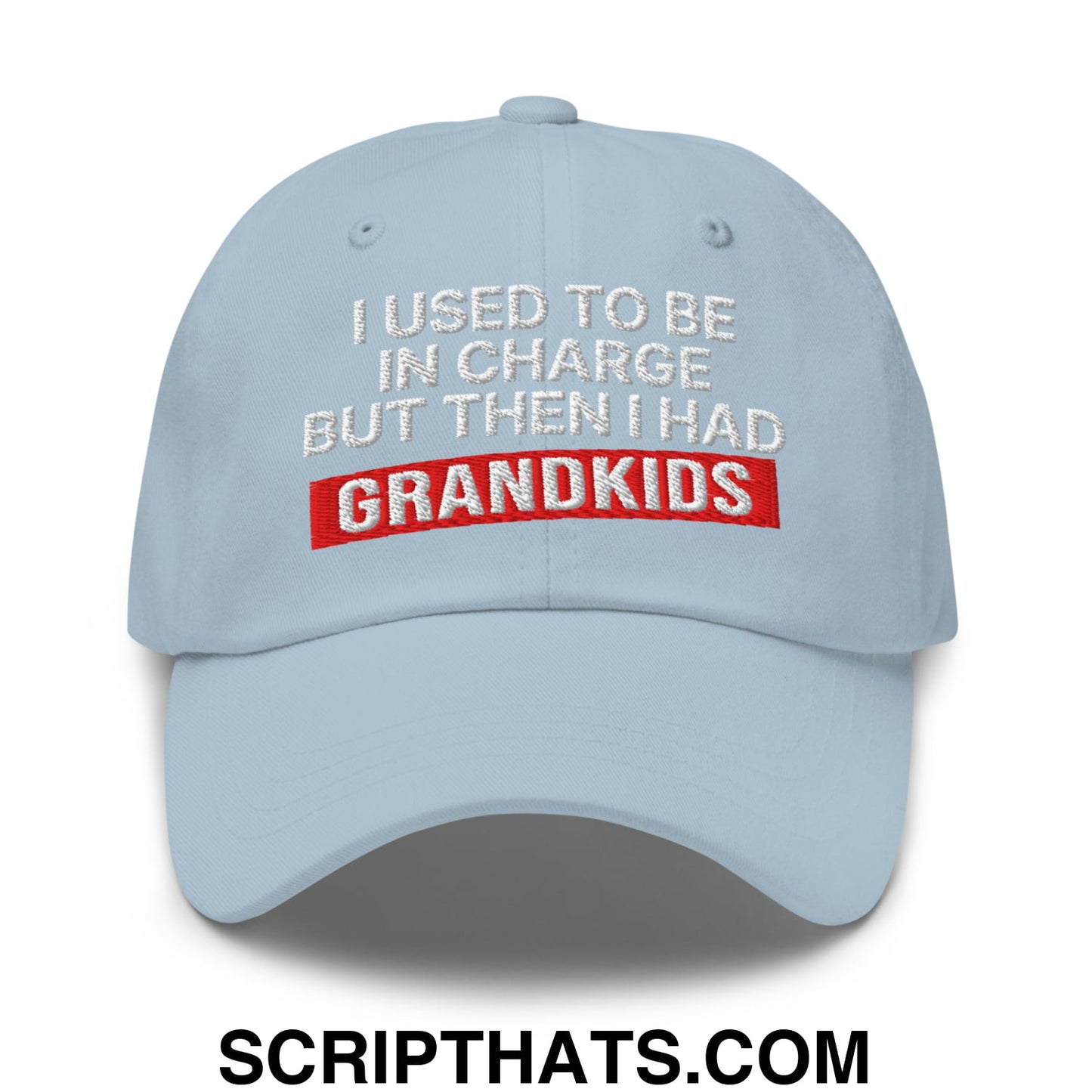 Light blue unstructured dad hat with white and red embroidered text i used to be in charge but then i had grandkids