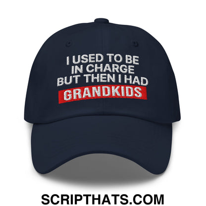 Navy blue unstructured dad hat with white and red embroidered i used to be in charge but then i had grandkids text
