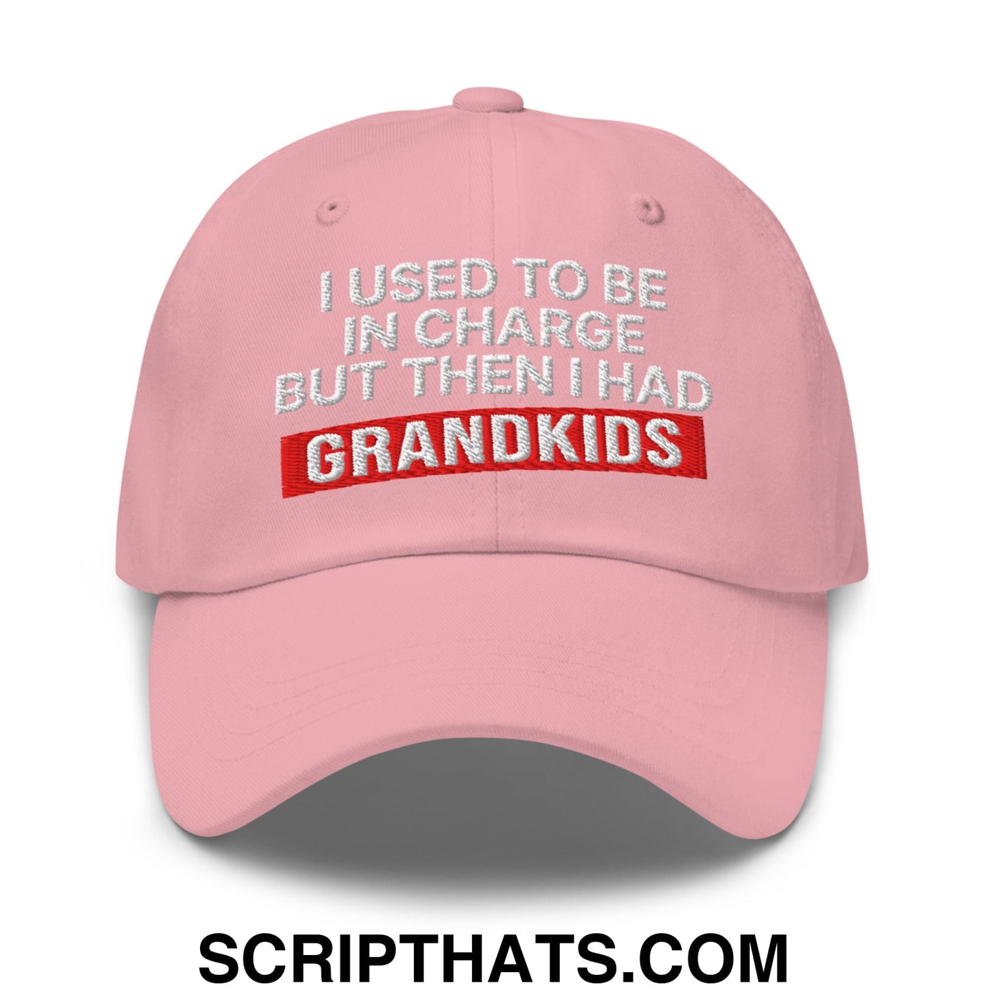 Pink unstructured dad hat with embroidered text i used to be in charge but then i had grandkids in white and red thread