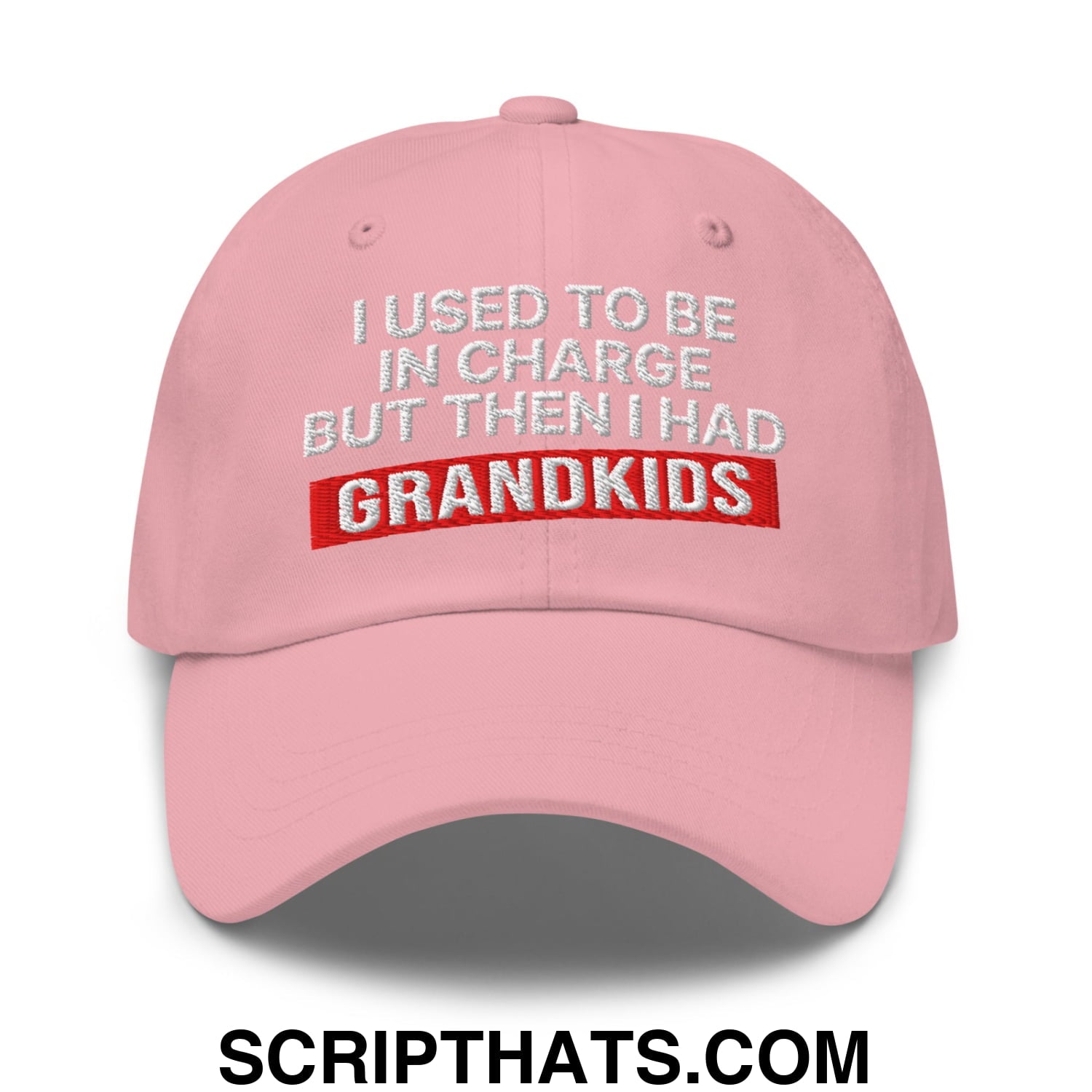 Pink unstructured dad hat with embroidered text i used to be in charge but then i had grandkids in white and red thread