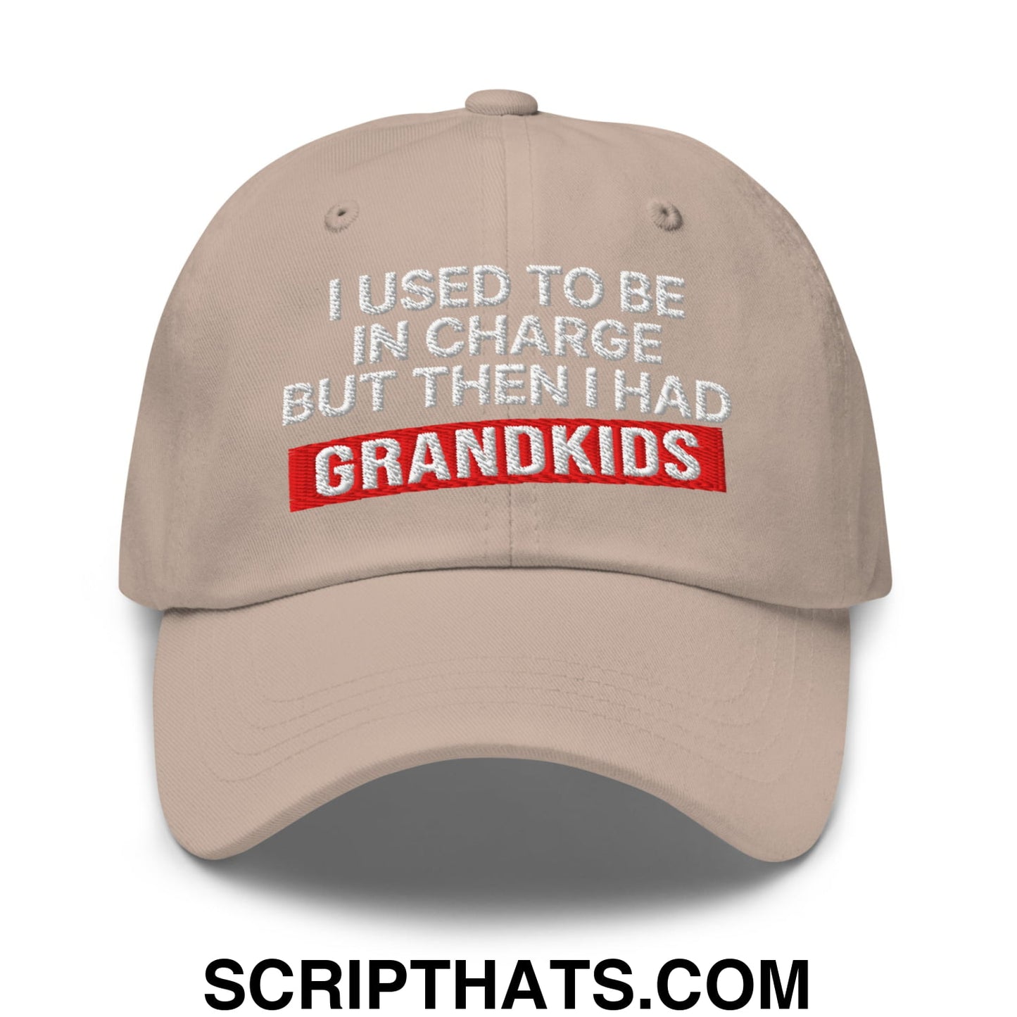 Beige unstructured dad hat with embroidered white and red text i used to be in charge but then i had grandkids