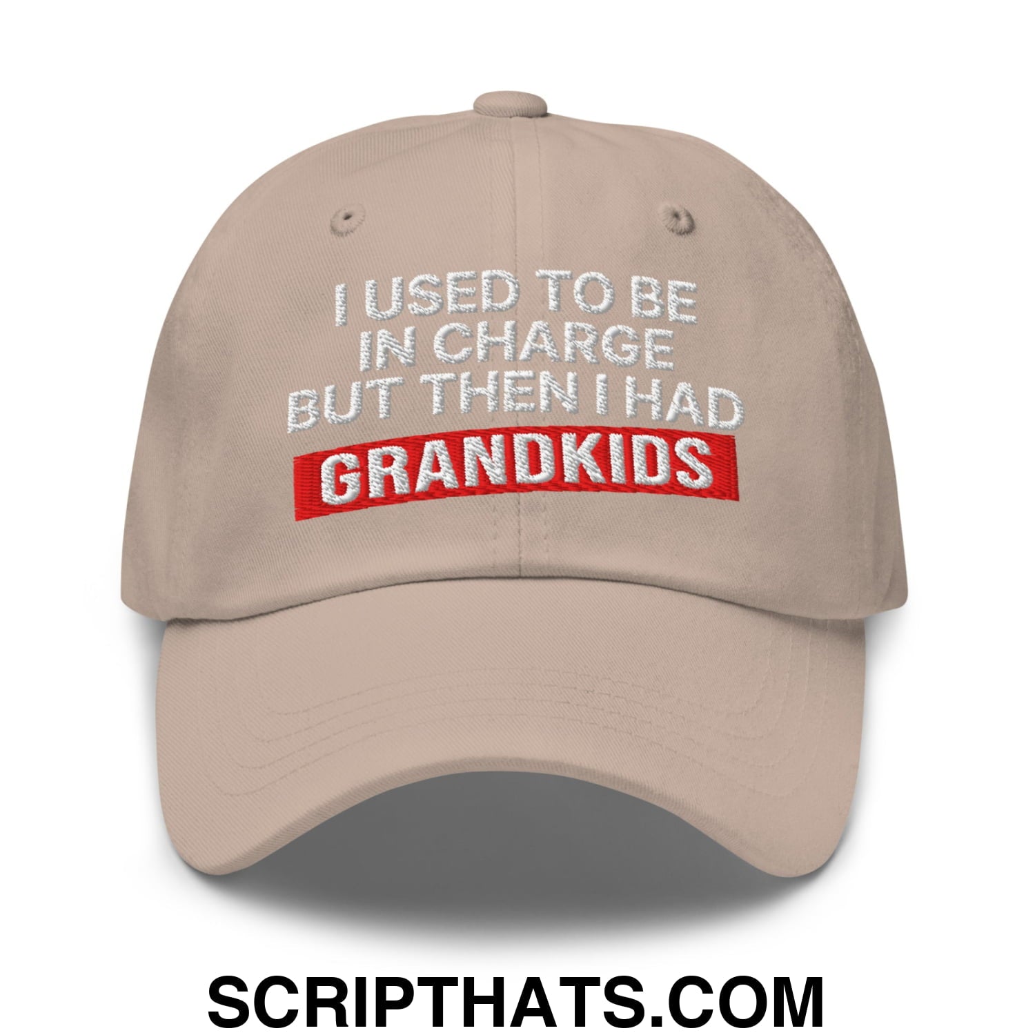 Beige unstructured dad hat with embroidered white and red text i used to be in charge but then i had grandkids