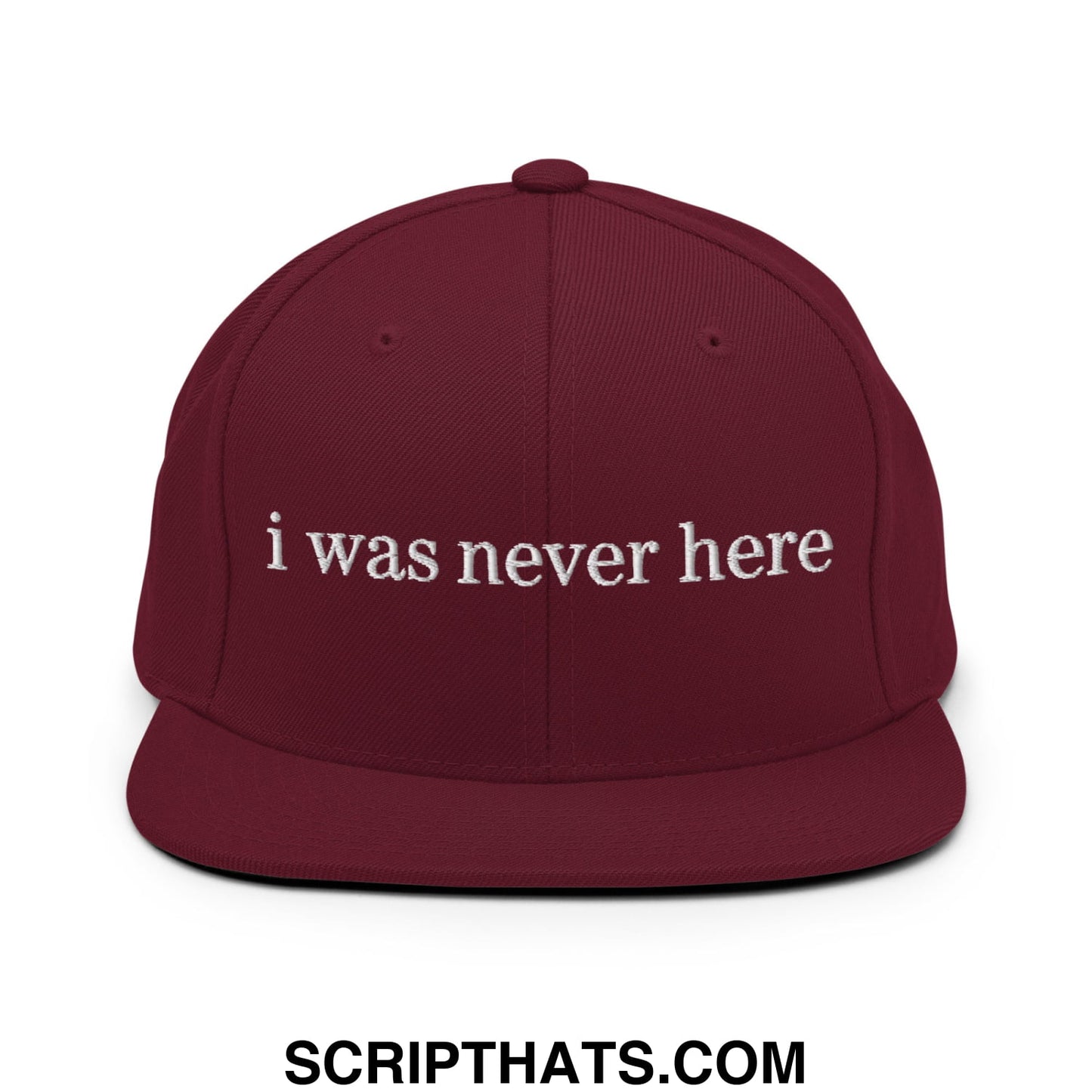 Maroon flat bill brim snapback hat with white embroidered i was never here text in a casual style