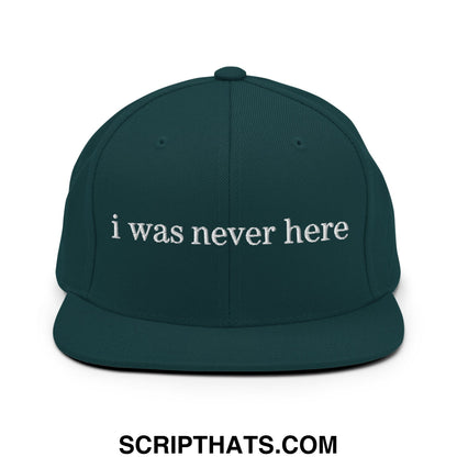Dark green snapback cap with white embroidered i was never here text featuring a flat bill brim design