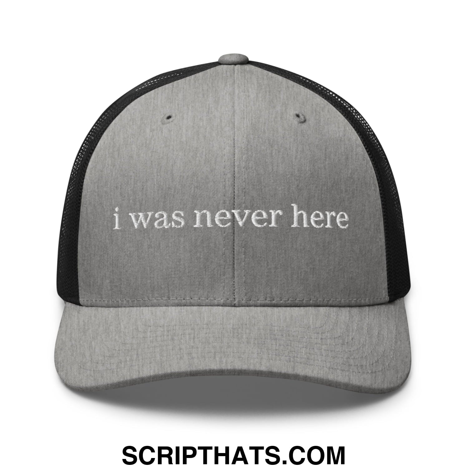 Gray trucker hat with black mesh sides and white embroidered phrase i was never here on front panel