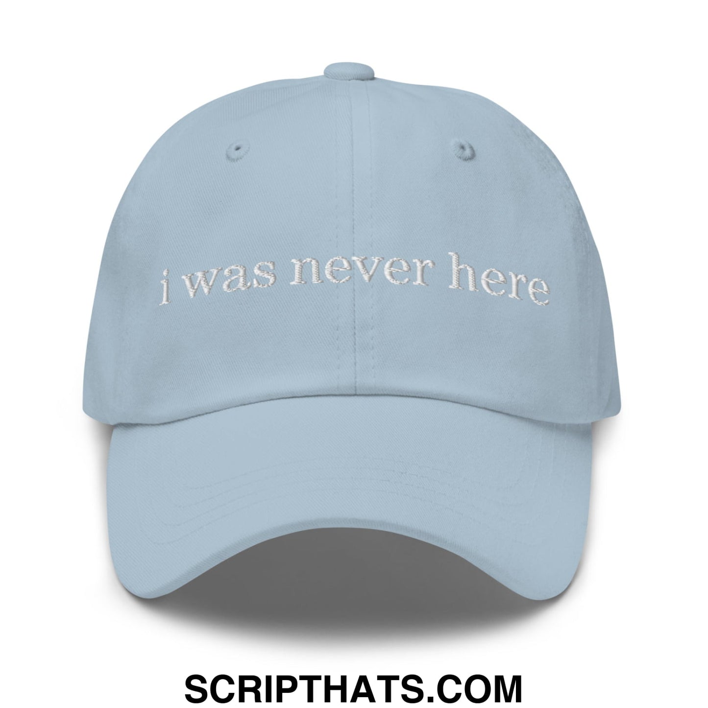 Light blue unstructured dad hat with white embroidered text i was never here perfect for casual wear