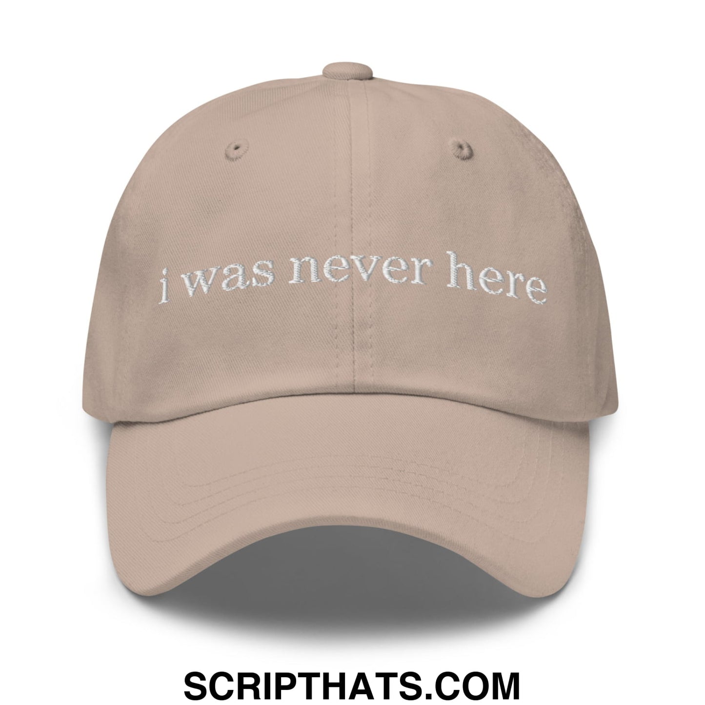 Beige unstructured dad hat with white embroidered text i was never here ideal for casual wear