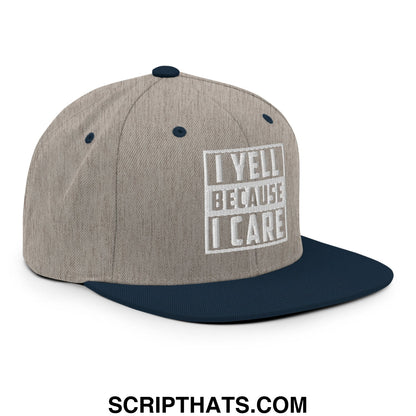Gray and navy blue snapback hat with heathered fabric crown flat bill brim and embroidered i yell because i care text
