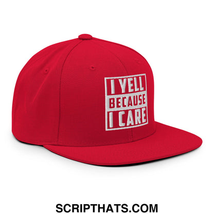 Red snapback hat with white embroidered i yell because i care text inside rectangular border flat bill brim
