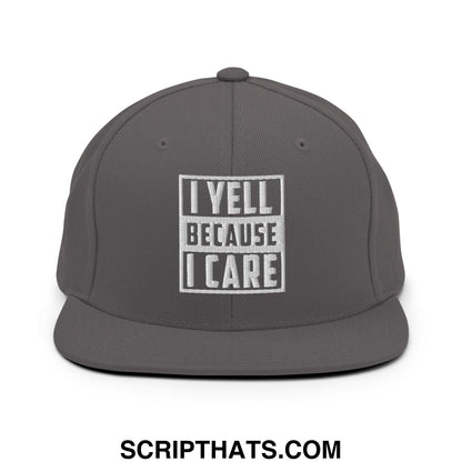 Gray snapback hat with white embroidered i yell because i care text in bold blocky font on flat bill brim