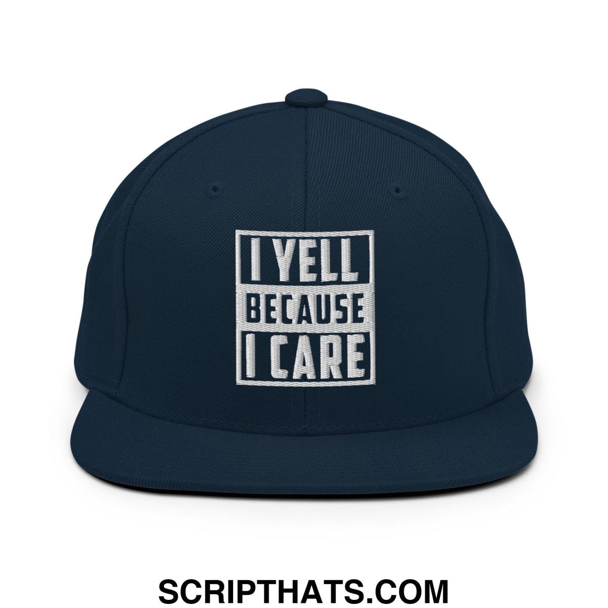 Navy blue snapback hat with white embroidered i yell because i care text in bold block font on the front panel