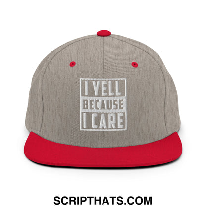 Gray and red snapback hat with white embroidered i yell because i care text inside a square border on the front